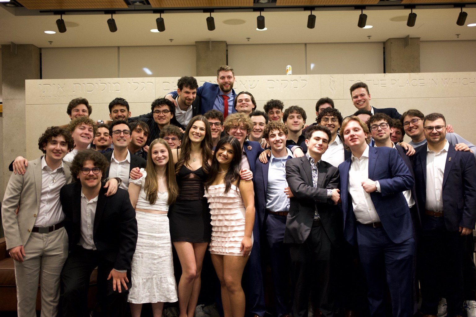Large group posing at a formal event